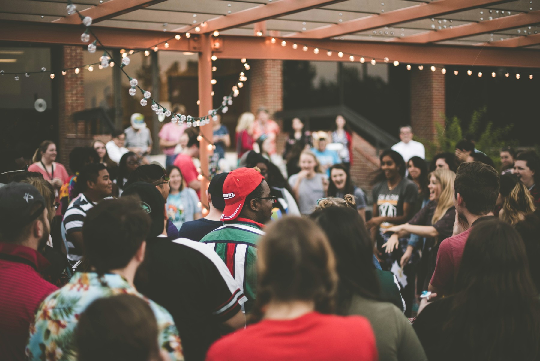 People sharing a thoughtful conversation in a community setting